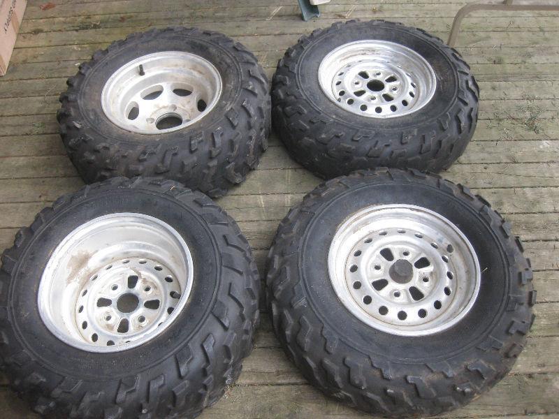 FOUR RIMS AND TIRES AS SHOWN