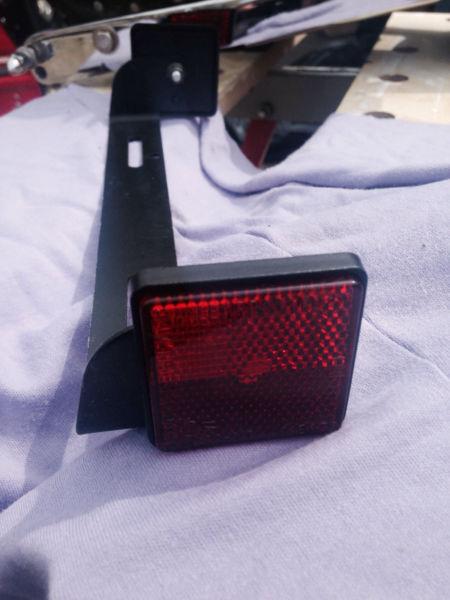 Motorcycle universal licence plate holder with reflector $5