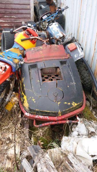 Old dirt bikes and snowmobile for parts