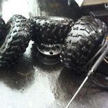 4 artic cat rims and 6 mud tires