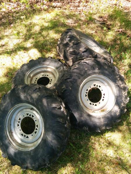 4 tires and rims from a polaris