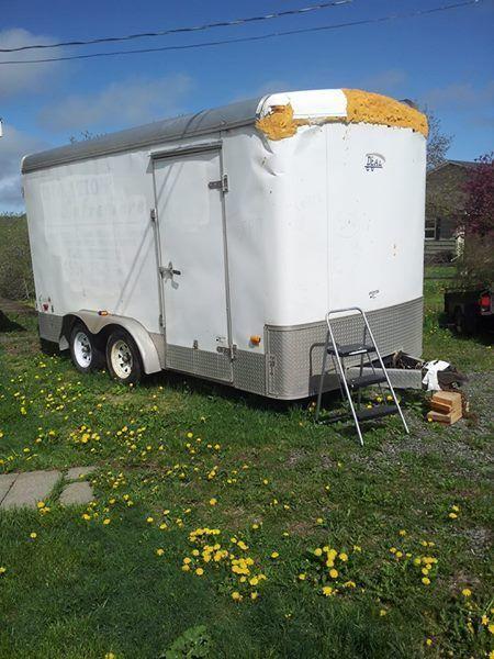 14x7 enclosed double axel with electric brakes, patched roof