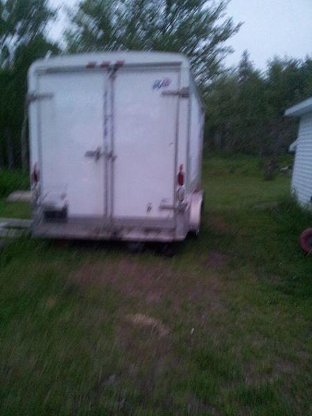 14x7 enclosed double axel with electric brakes, patched roof