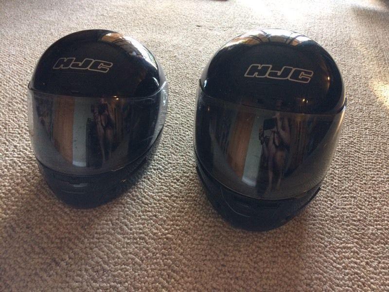 Two motor bike helmets