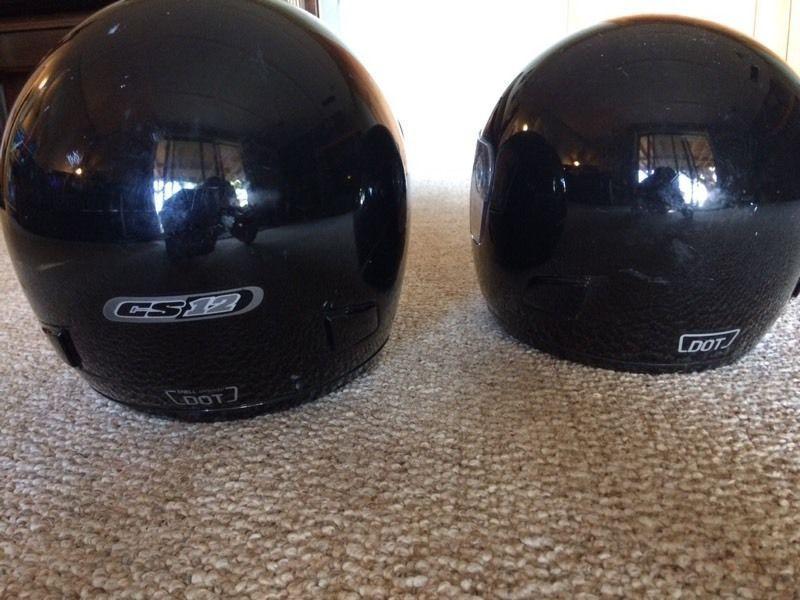 Two motor bike helmets