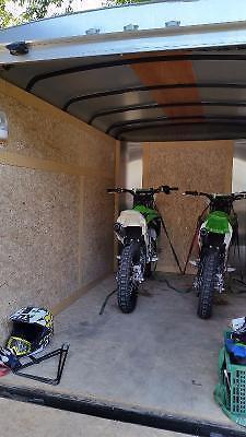 2 brand new motocross bikes and trailer