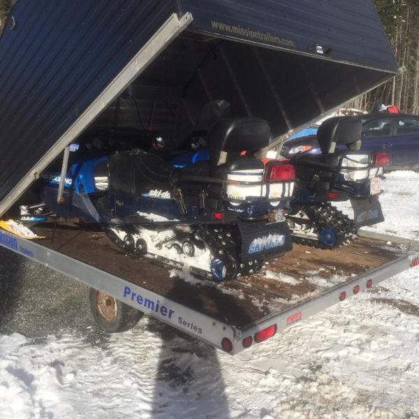 Two bombardier skidoos incl clamshell trailer