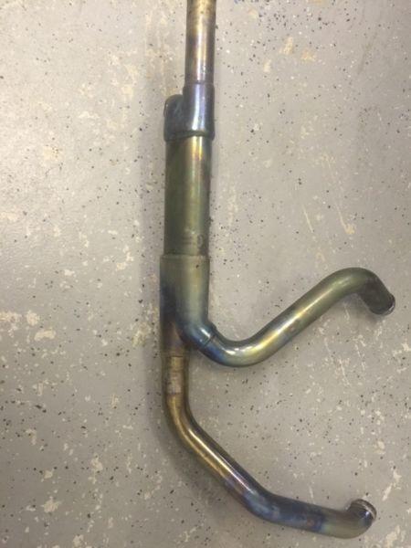 Decatted stock exhaust for Harley touring