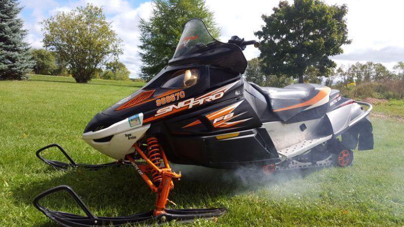 Arctic Cat snowmobiles and Triton trailer