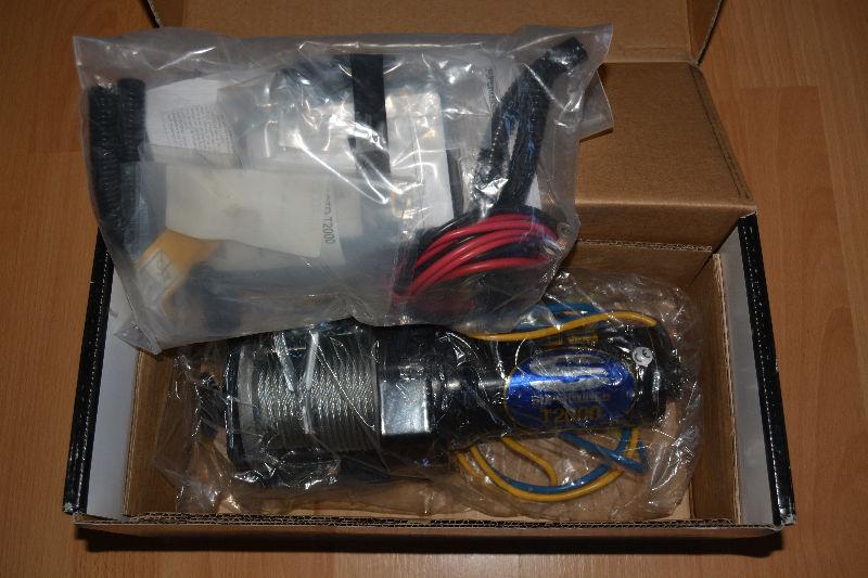 New, still in the box and plastic, 200 lb Electric Winch